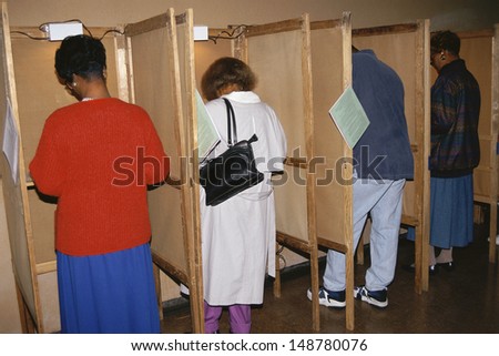 LOS ANGELES, CA - CIRCA 1992: Voters selecting candidates in voting booths in Los Angeles, CA