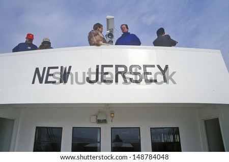 NEW JERSEY - TRENTON - CIRCA 1990\'s: New Jersey written on a ship with tourists on board in Trenton, New Jersey