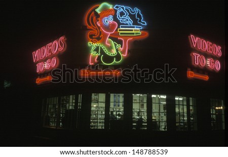 MIDWEST - CIRCA 1990\'s: Neon sign of a video store