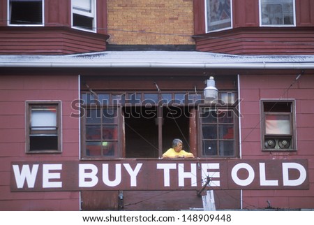 DETROIT, MI - CIRCA 1990\'s: A sign that reads `we buy the old` on an antiques store in Detroit, MI