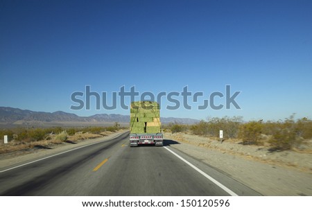CALIFORNIA - CIRCA 2004: Hay truck drives back highways of Southern California