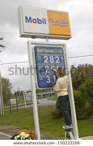 NEW HAMPSHIRE - CIRCA 2005: Upping the gas prices at a Mobil station in New Hampshire