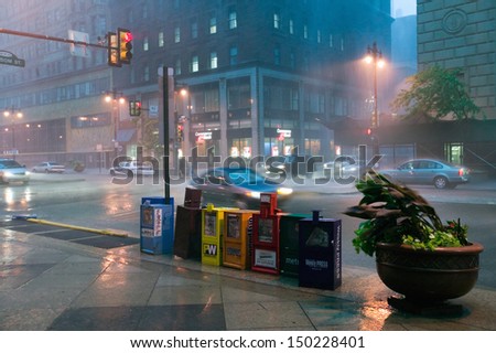 PHILADELPHIA, PA. - CIRCA 2005: Newspaper stands during rain storm in downtown Philadelphia, Pennsylvania