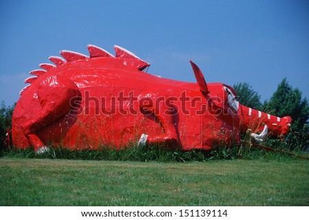 BERRYVILLE ARKANSAS - CIRCA 1980\'s: Roadside attraction of metal sculptured red dinosaur, Berryville AR