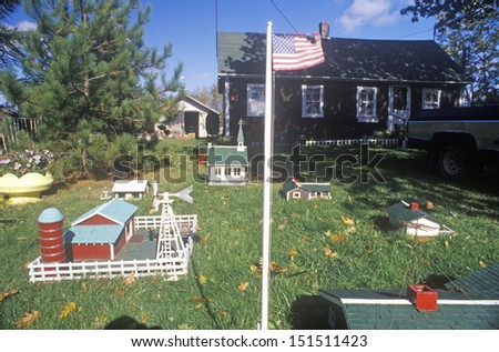 NEW ENGLAND - CIRCA 1980\'s: Overview of miniature farm with flag and village, New England