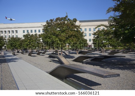 Airplane appears to fly into the Pentagon Memorial which features 184 empty benches, a Memorial to commemorate the anniversary of the September 11, 2011 attacks in Arlington VA., Washington, DC, USA.