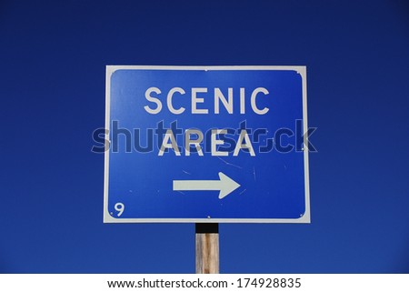 A road sign points to a scenic area in the United States.