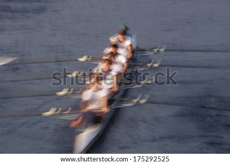 Crew in motion rowing boat, Charles River, Boston MA.