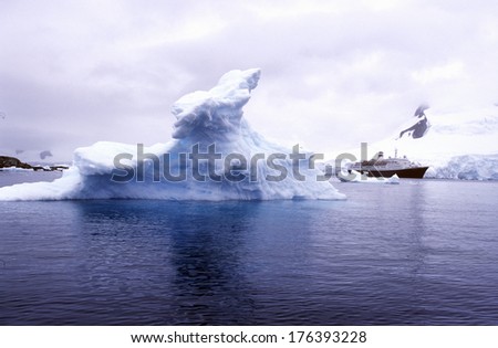 Cruise ship Marco Polo with glaciers and icebergs in Paradise Harbor, Antarctica