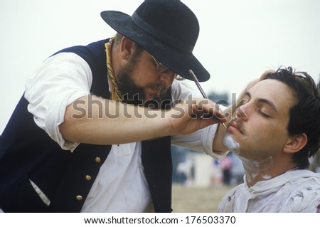 Confederate participants shaving in camp scene during recreation of Battle of Manassas, marking the beginning of the Civil War