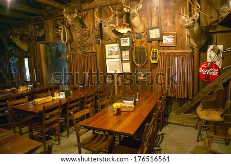 Interior of rustic old restaurant with hunting lodge