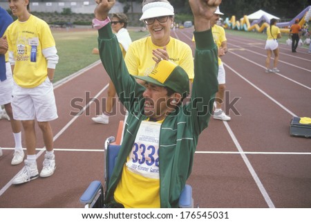 Handicapped Athlete cheering at finish line, Special Olympics, UCLA, CA