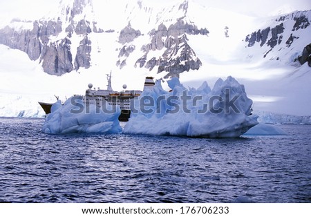 Cruise ship Marco Polo with glaciers and icebergs in Errera Channel at Culverville Island, Antarctica