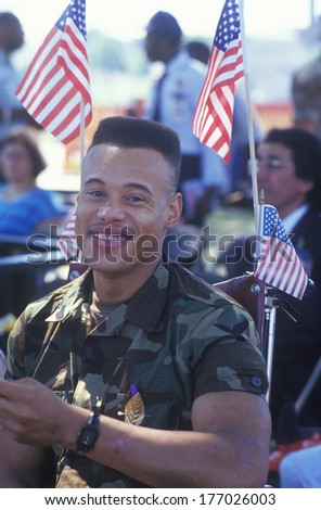 African-American Soldier in Wheelchair with American Flags, Washington, D.C.