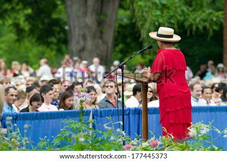Woman in red dress at ceremony for new American citizens at Independence Day Naturalization Ceremony on July 4, 2005 at Thomas Jefferson\'s home, Monticello, Charlottesville, Virginia.