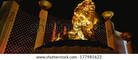 This Is The Mgm Grand Hotel. On The Outside Is The Famous Mgm Lion From Their Logo. The Surrounding Area Is Lighted To Show The Golden Lion Sitting On A Large Platform.