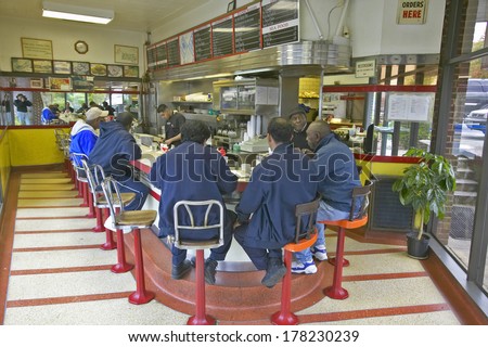 People eating breakfast at diner counter at old Waffle Shop in Washington DC