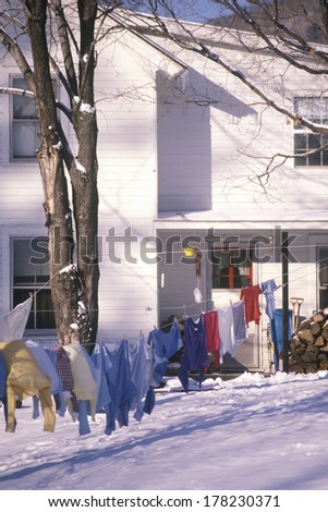Clothes on laundry line in snowy yard, Woodstock, NY