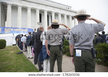 National Parks Rangers salute at the Let Freedom Ring ceremony at the Lincoln Memorial August 28, 2013 in Washington, DC, commemorating the 50th anniversary of Dr. Martin Luther King speech.
