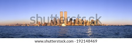 Panoramic view of sailboat on the Hudson River, lower Manhattan and New York City skyline, NY with World Trade Towers at sunset