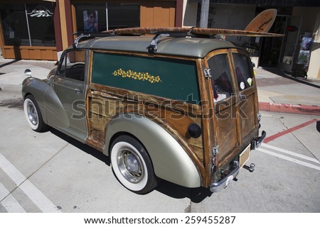 Mini woody station wagon with surf board, Ventura, California, USA, 05.02.2014