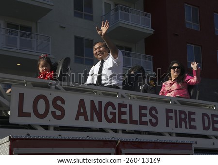 Chinese-American LA Fire Dept waves at 115th Golden Dragon Parade, Chinese New Year, 2014, Year of the Horse, Los Angeles, California, USA, 02.01.2014