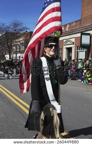 Woman marches with US Flag, St. Patrick\'s Day Parade, 2014, South Boston, Massachusetts, USA, 03.16.2014