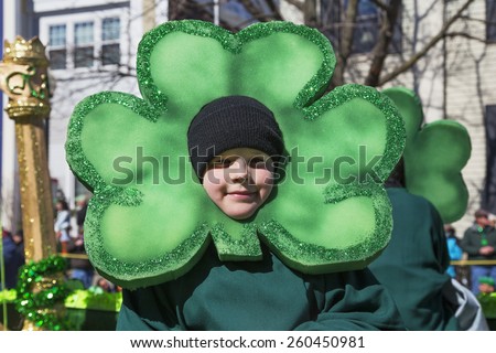 Little boy and green cloverleaf, St. Patrick\'s Day Parade, 2014, South Boston, Massachusetts, USA, 03.16.2014