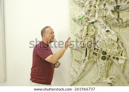 Tourist looks at painting at the Museum of Modern and Contemporary Art of Nice, Nice, France, model release