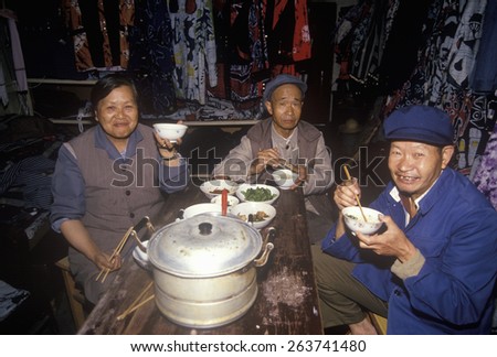 Family eating dinner in Dali, Yunnan Province, People\'s Republic of China