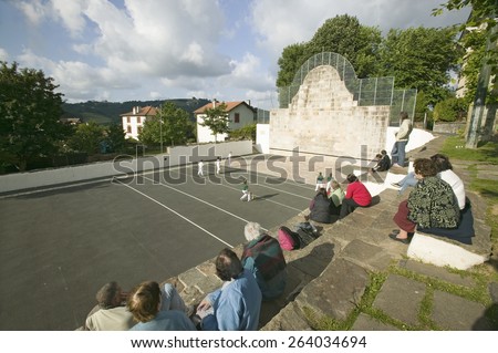 Local villagers in Sare, France, in Basque Country on the Spanish-French border, watch Jai Li game near St. Jean de Luz, on the Cote Basque, South West France