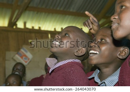 Karimba School with school children smiling in classroom in North Kenya, Africa