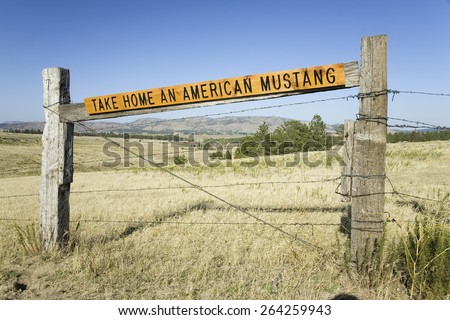 Sign for Take Home an American Mustang at the Black Hills Wild Horse Sanctuary, the home to America\'s largest wild horse herd, Hot Springs, South Dakota