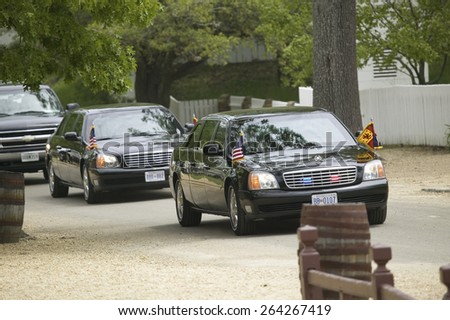 Black Presidential Limo and American Flag and motorcade pulling up in front of Governor's Palace in Williamsburg, Virginia on May 4, 2007