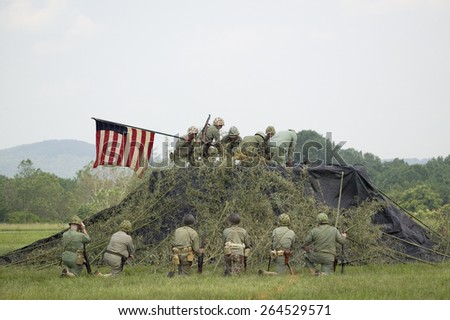 A World War II reenactment of US Marines raising the American flag on Iwo Jima on February 23, 1945 at Mid-Atlantic Air Museum World War II Weekend and Reenactment in Reading, PA held June 18, 2008