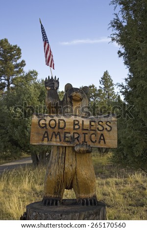 A wooden bear and US Flag stating God Bless America, Ridgway, Colorado
