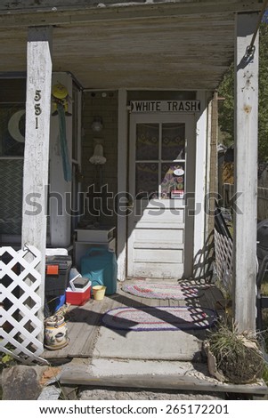 White Trash sign in doorway of junky house in Telluride, Colorado