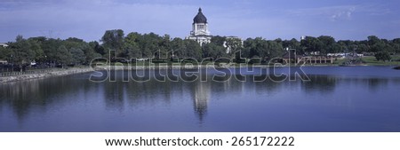 Panoramic view of lake with view of South Dakota State Capitol and complex, Pierre, South Dakota, built between 1905 and 1910