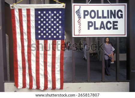 Children at the entrance to a polling place, CA