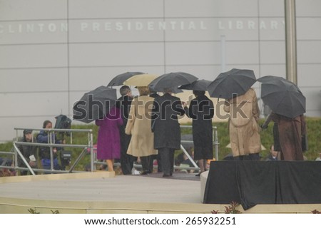 US President, former US Presidents, first wives and others leave the stage after the grand opening ceremony of the William J. Clinton Presidential center in Little Rock, AK 18 November 2004.