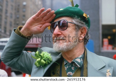 A man saluting the flag at the 1987 St. Patrick\'s Day Parade, NY City