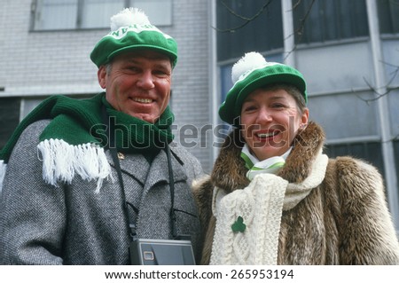 A couple dressed warmly to watch the 1987 St. Patrick\'s Day Parade, NY City