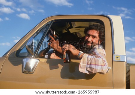 A Mexican-American in a pickup truck with a beer bottle, Chimayo, NM