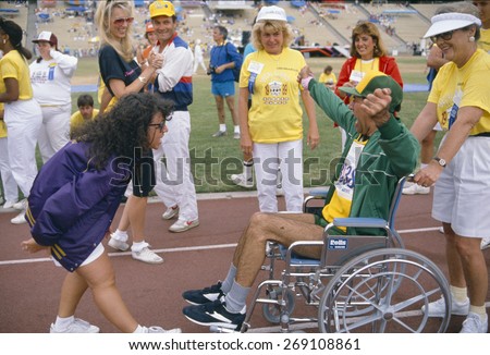 A man in a wheelchair competes at the Special Olympics,