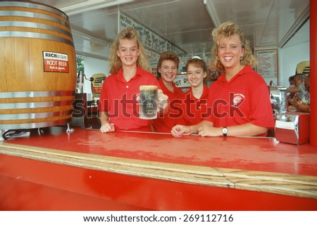 Four young women serving root beer at a local diner, Cleveland, OH