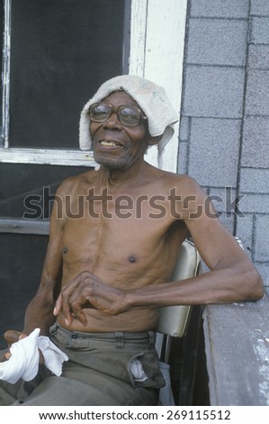 An African-American senior citizen on porch, Cairo, IL
