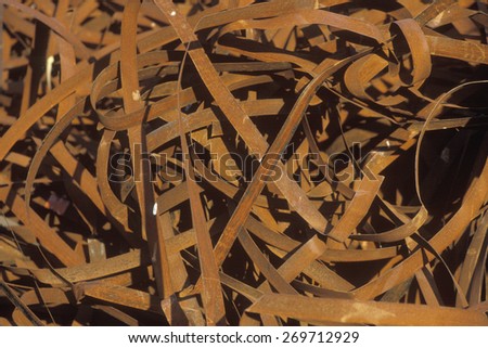 Rusting metal bands sitting in a pile