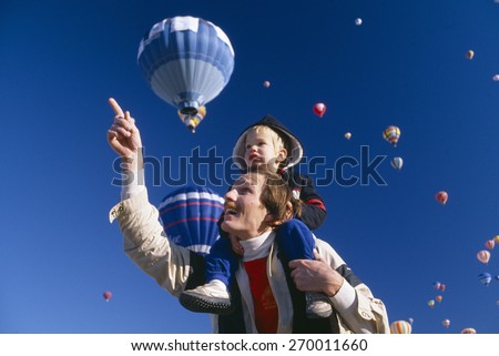 Father with young son on his shoulders, Albuquerque\'s Hot Air Balloon Festival, New Mexico