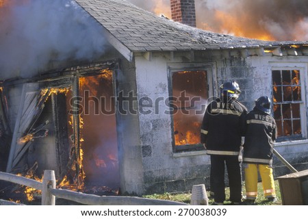 Firemen putting out a house on fire, West Virginia