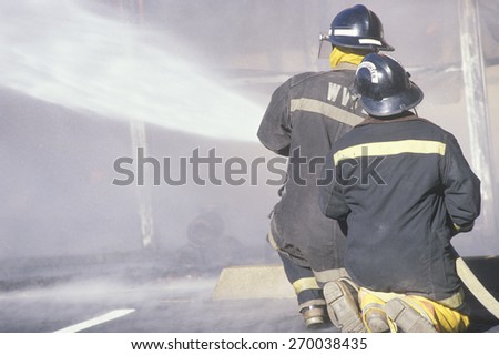Firemen putting out a house on fire, West Virginia